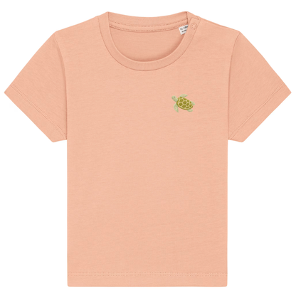 Heytoki Baby-T-Shirt aus Bio-Baumwolle in Fraiche Peche (Pfirsich) mit gesticktem Schildkrötenmotiv